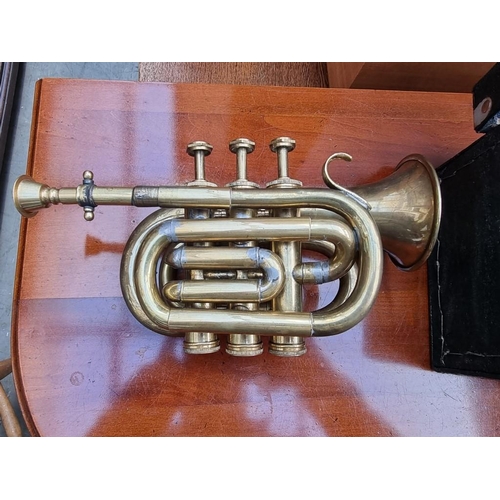 1263 - A vintage Boosey 'Heley' brass pocket or piccolo cornet, in case.