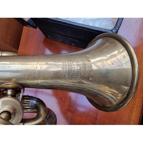 1263 - A vintage Boosey 'Heley' brass pocket or piccolo cornet, in case.