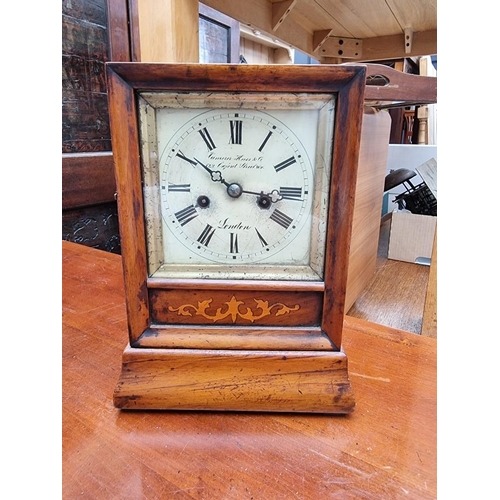 1270 - A Victorian walnut and inlaid mantel clock, by Camerer, Kuss, Tritschler & Co, 24cm high, with p... 