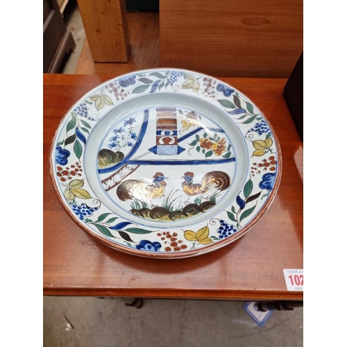 1274 - Two pairs of French tin glazed pottery plates; together with two Victorian ironstone plates. (6)... 