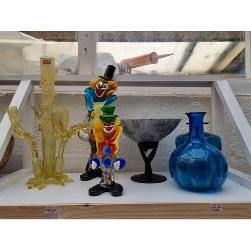 1282 - A mixed group of glassware, to include a Venetian clown, 36cm high. (two shelves)