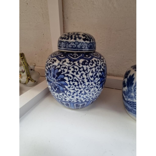 1294 - Ten Chinese blue and white ginger jars and covers, largest 15cm high.