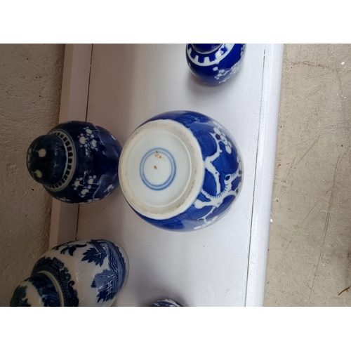 1294 - Ten Chinese blue and white ginger jars and covers, largest 15cm high.