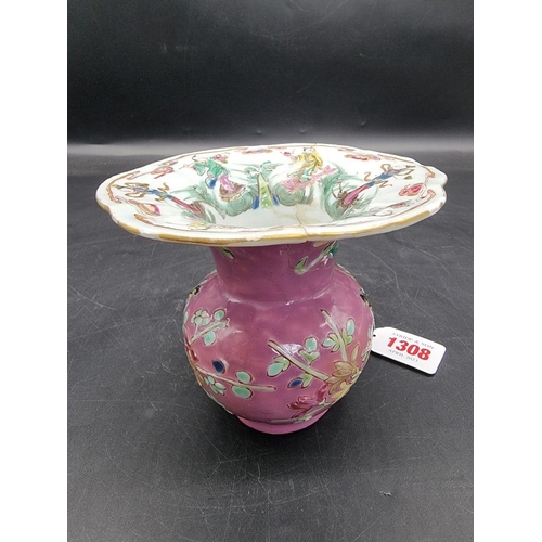 1308 - A Chinese famille rose pink ground spittoon, Yongzheng, with relief moulded decoration to the exteri... 