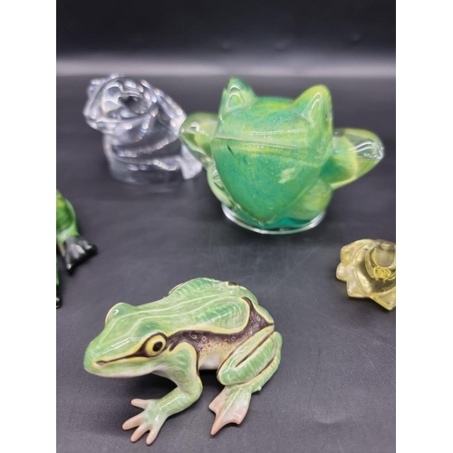 1312 - Seven frog models, to include: a Daum green glass example, 8.5cm high; an Orrefors clear glass examp... 