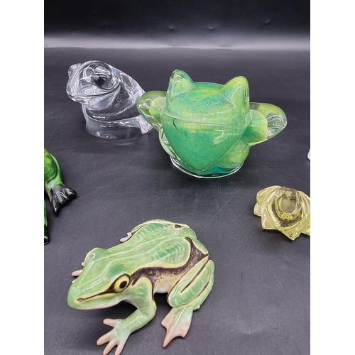 1312 - Seven frog models, to include: a Daum green glass example, 8.5cm high; an Orrefors clear glass examp... 