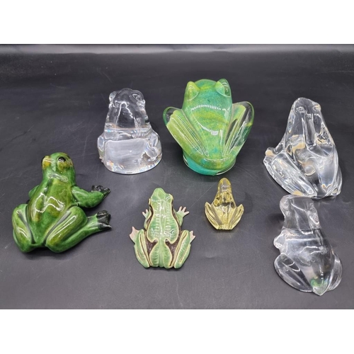 1312 - Seven frog models, to include: a Daum green glass example, 8.5cm high; an Orrefors clear glass examp... 