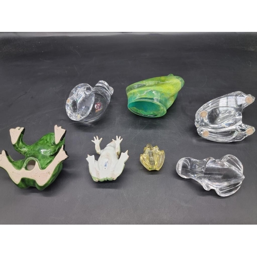 1312 - Seven frog models, to include: a Daum green glass example, 8.5cm high; an Orrefors clear glass examp... 