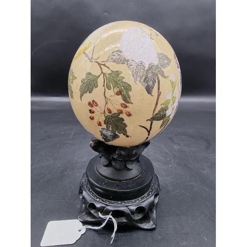 1315 - Natural History: a painted ostrich egg, decorated with garden birds, monogramed and dated 1981, on s... 