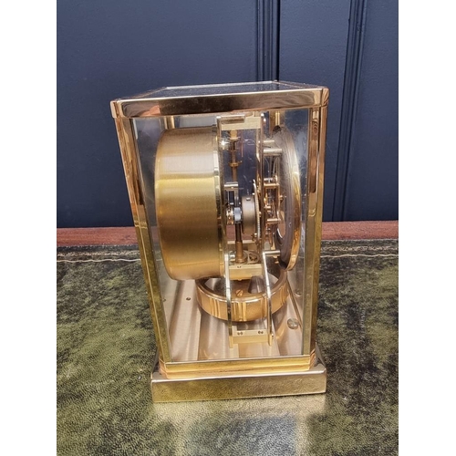 1328 - A Jaeger Le Coutre brass Atmos clock, No.564140. 