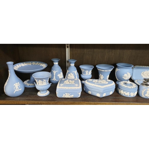 1334 - A large collection of Wedgwood pale blue jasperware.  