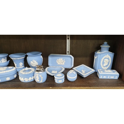 1334 - A large collection of Wedgwood pale blue jasperware.  