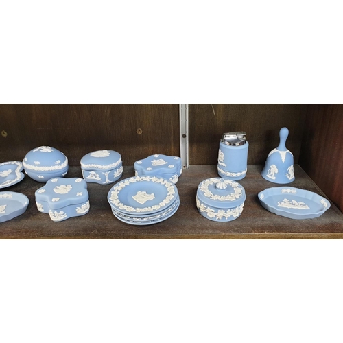 1334 - A large collection of Wedgwood pale blue jasperware.  