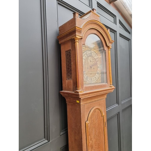 1335 - An 18th century oak, painted and parcel gilt 8 day longcase clock, the 11in arched brass dial inscri... 