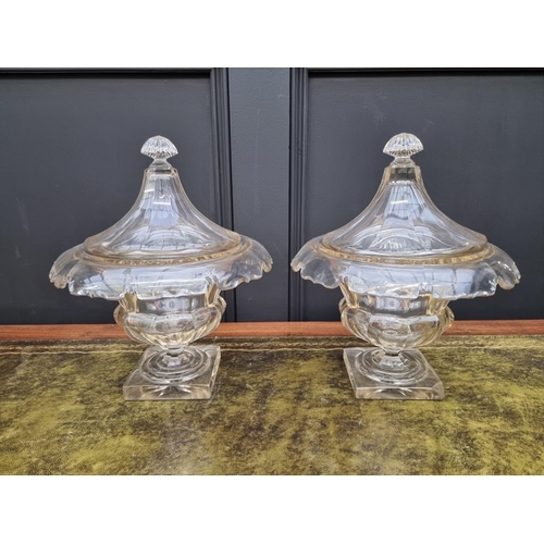 1338 - A pair of 19th century cut glass pedestal bowls and covers, possibly Irish, 30cm high, (chip to corn... 