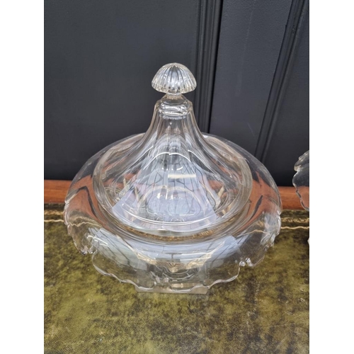 1338 - A pair of 19th century cut glass pedestal bowls and covers, possibly Irish, 30cm high, (chip to corn... 