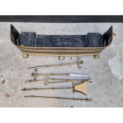 1339 - A Victorian brass fender and matching fire irons, 97.5cm wide. 