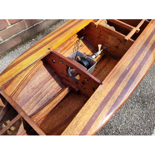 1373 - A large mahogany model launch or speedboat, with engine, 164cm long, on wood stand. ... 