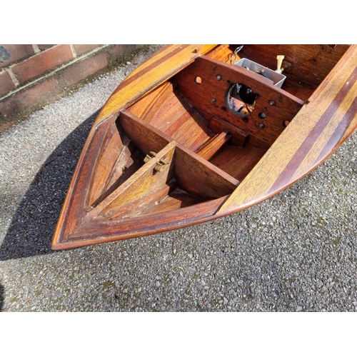 1373 - A large mahogany model launch or speedboat, with engine, 164cm long, on wood stand. ... 