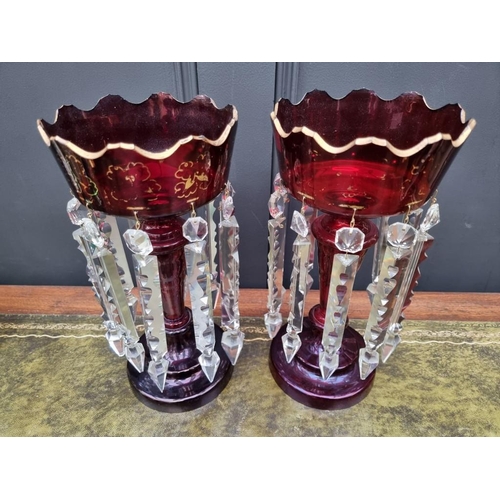 1384 - A pair of antique ruby glass lustres, 32cm high. 