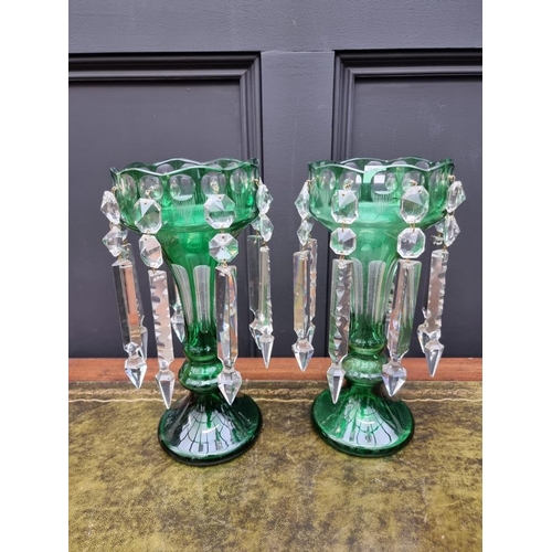 1386 - A pair of antique green flashed glass lustres, 31cm high.