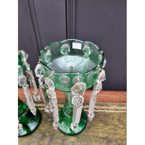 1386 - A pair of antique green flashed glass lustres, 31cm high.