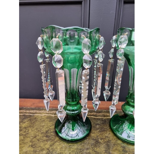 1386 - A pair of antique green flashed glass lustres, 31cm high.