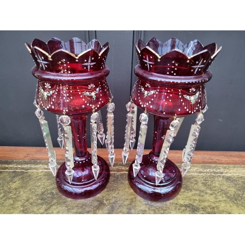 1387 - A pair of antique ruby glass lustres, 36cm high.