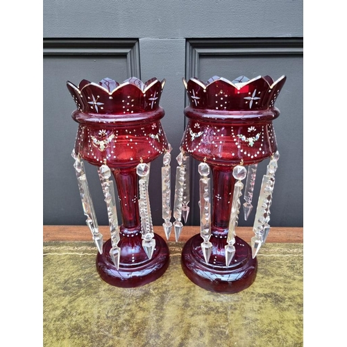 1387 - A pair of antique ruby glass lustres, 36cm high.