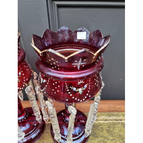 1387 - A pair of antique ruby glass lustres, 36cm high.