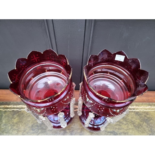 1387 - A pair of antique ruby glass lustres, 36cm high.