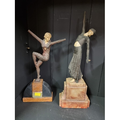 1398 - Two Art Deco style resin figures of dancing ladies, in the manner of Demetre Chiparus, on onyx bases... 