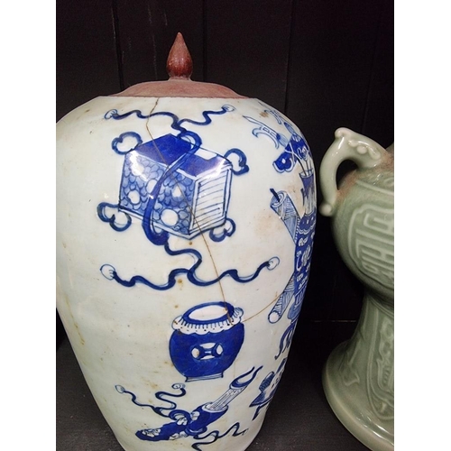 1399 - A Chinese blue and white ovoid jar, 19th century, painted with auspicious objects, (cracked), w... 