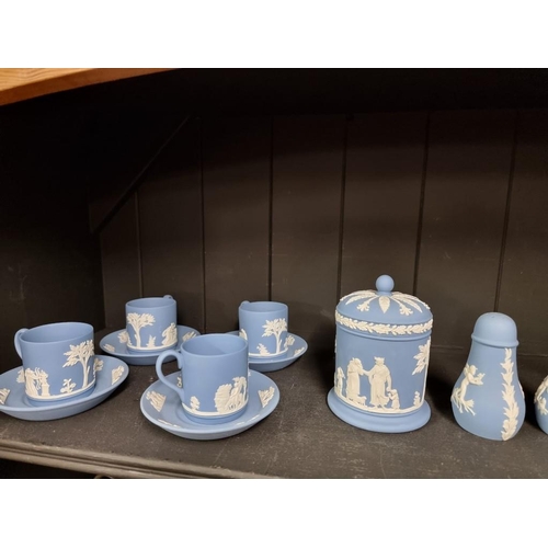 1401 - A Wedgwood pale blue jasperware part tea service, together with a matching pair of pepperettes.... 