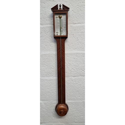 1404 - A reproduction mahogany stick barometer. 