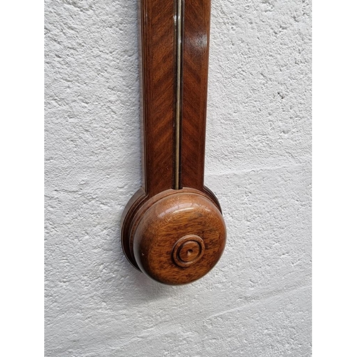 1404 - A reproduction mahogany stick barometer. 