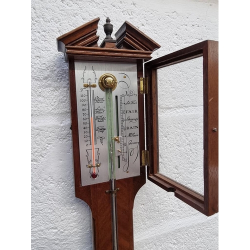 1404 - A reproduction mahogany stick barometer. 