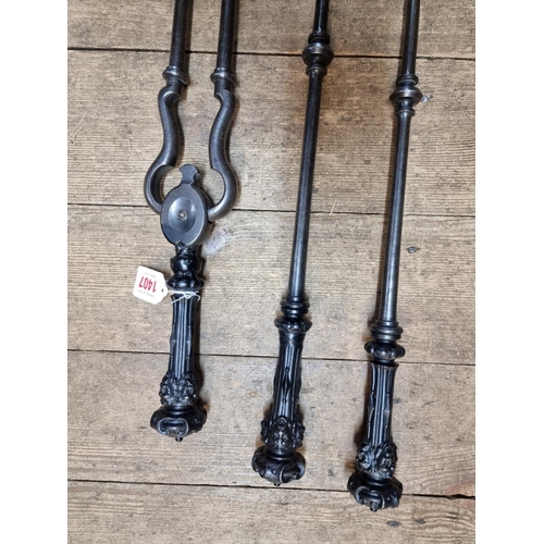 1407 - A set of three Victorian fire irons, (repairs).  