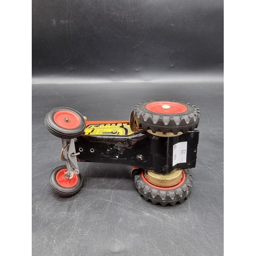 1412 - A tinplate clockwork tractor. 