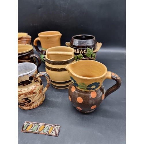 1414 - A collection of 19th century French pottery, to include marbled and slip glazed items, largest 17cm ... 