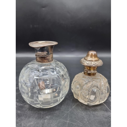 1420 - Two silver mounted cut glass scent bottles, largest 12.5cm high.