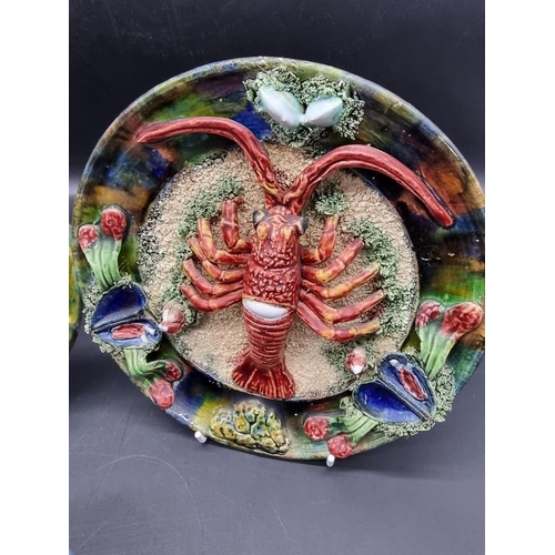 1426 - Two late 19th/early 20th century Palissy style majolica plates, one by Joaquim G Roque Casadinho, th... 