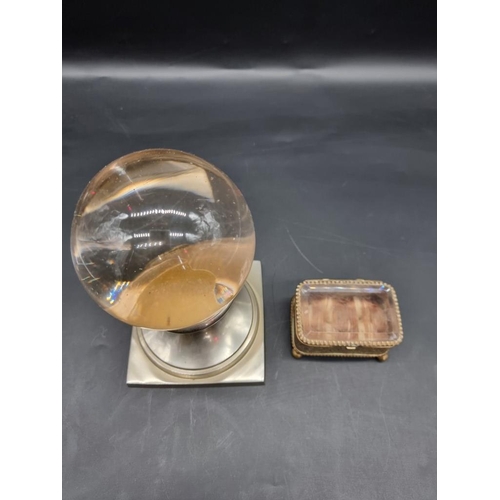 1429 - A crystal ball, on nickel plated stand, 20cm high; together with a brass casket, 8.5cm wide. ... 