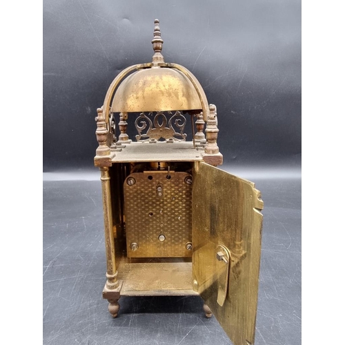 1443 - A brass lantern style clock, the dial inscribed 'Hampton & Sons Ltd, Pall Mall East', the moveme... 