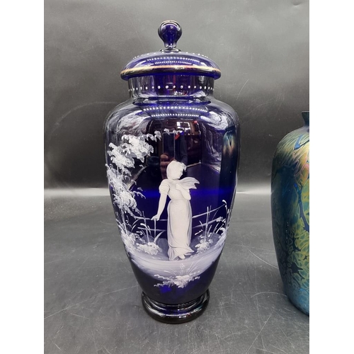 1444 - A large Bristol blue glass Mary Gregory style vase and cover, largest 32.5cm; together with two Isle... 