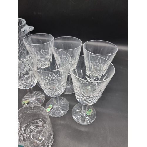 1446 - A set of six Waterford 'Lismore' pattern wine glasses, 7.5cm high, boxed; together with a Tiffa... 