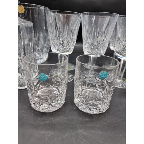 1446 - A set of six Waterford 'Lismore' pattern wine glasses, 7.5cm high, boxed; together with a Tiffa... 