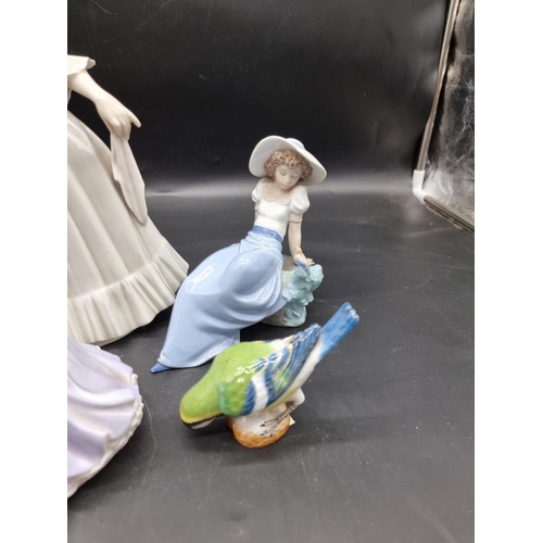 1447 - A Meissen blue tit, 8.5cm high; together with a Lladro figure group; two Nao figures; and two others... 