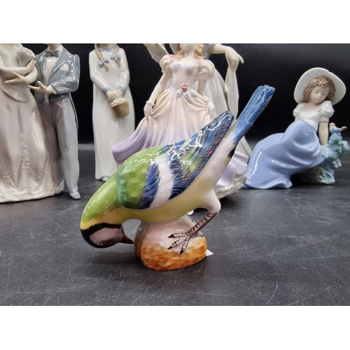 1447 - A Meissen blue tit, 8.5cm high; together with a Lladro figure group; two Nao figures; and two others... 