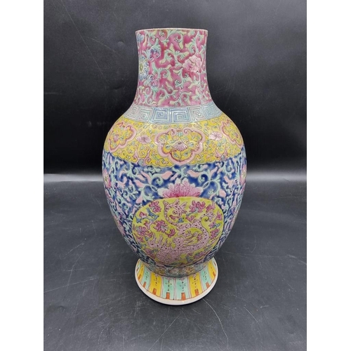 1450 - A Chinese famille rose vase, 34.5cm high, (a.f.); together with a pair of 18th century Chinese blue ... 